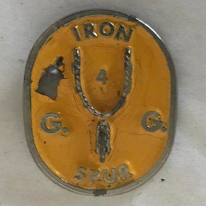 VINTAGE yellow Iron Spur G.G. 4 lapel pin